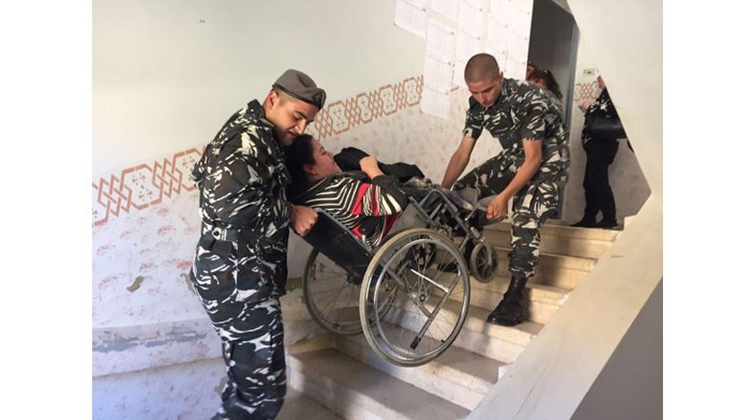 carrying wheelchair up stairs