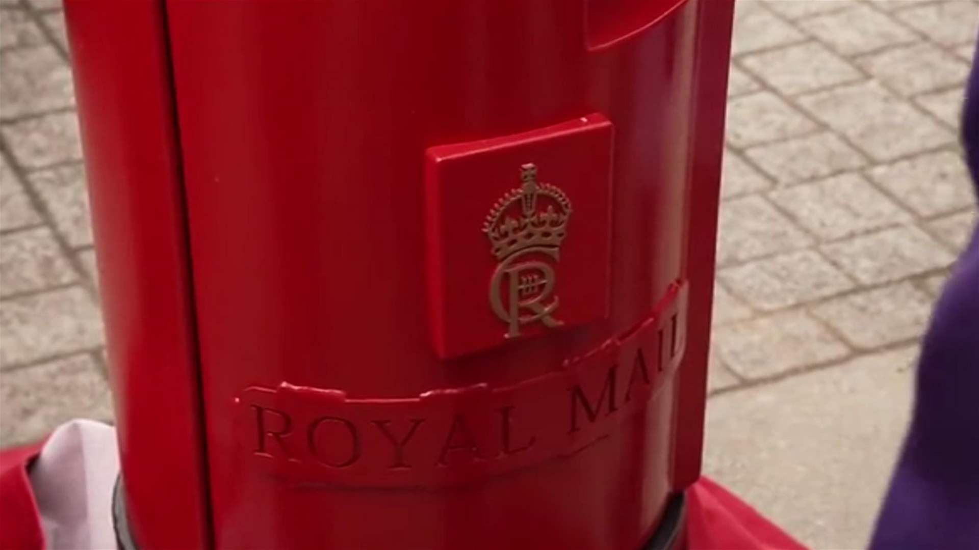 Britain unveils first red postbox bearing King Charles&#39; emblem