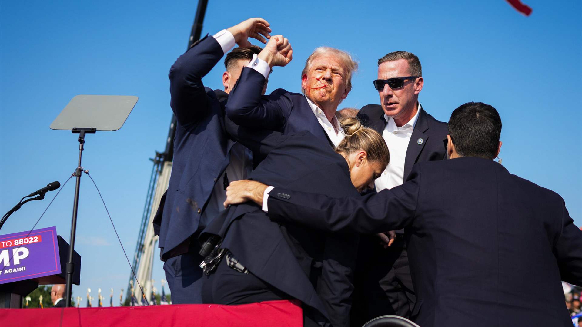 Former US president Donald Trump seen walking off his plane after shooting