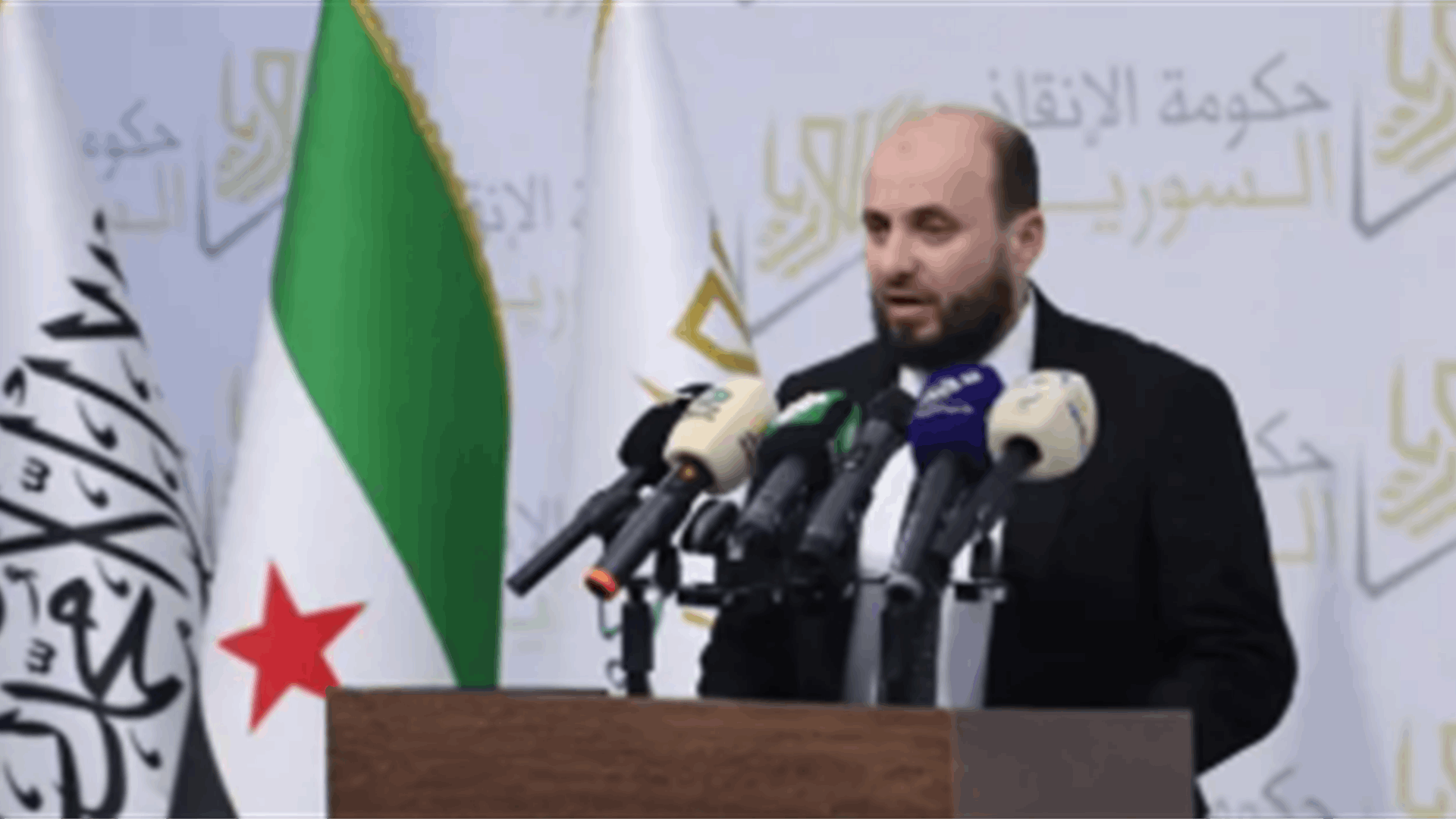 Source in Syria&#39;s new leadership tells LBCI: Al Tawhid flag displayed alongside Syrian revolution flag, not linked to Jabhat al-Nusra or Hayat Tahrir al-Sham