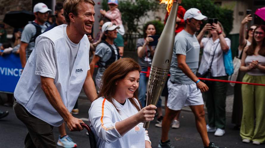 AFP journalists wounded in Lebanon join Olympic torch relay