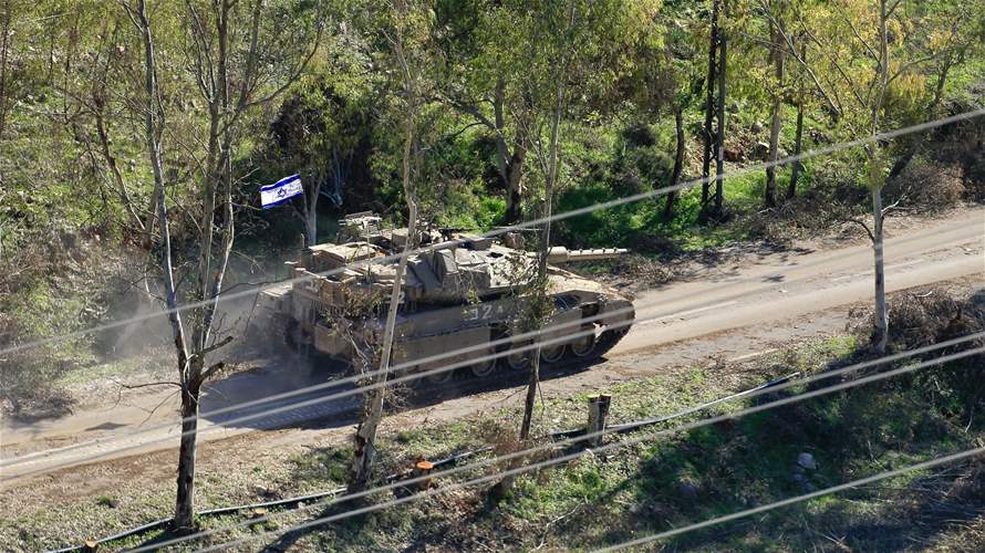 Israeli bulldozers conduct excavation work in southern Lebanon under tank protection