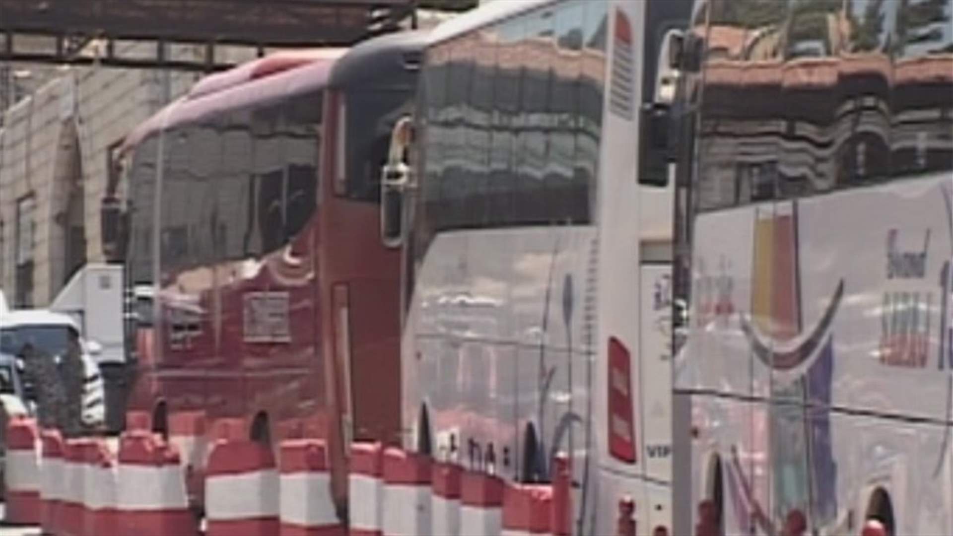 Buses carrying Syrian refugees depart from Masnaa border crossing