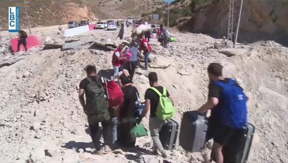 Targeting the Masnaa Border Crossing: Travelers to Syria walk on foot